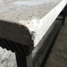 Damaged marble-top coffee table