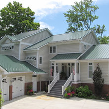 green metal roof houses