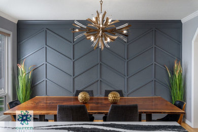 Example of a large trendy wall paneling kitchen/dining room combo design in Portland with black walls