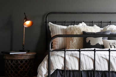 Example of a large transitional carpeted and gray floor bedroom design in Other with gray walls