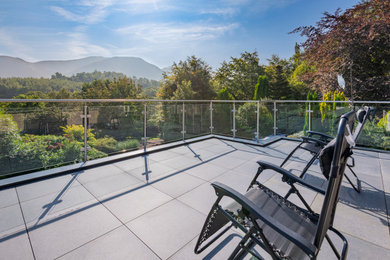 Inspiration for a medium sized rural courtyard private and first floor glass railing terrace in Other with no cover.