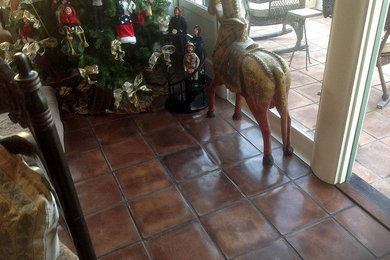 Inspiration for a mid-sized open concept terra-cotta tile game room remodel in San Francisco with white walls