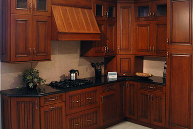 Mid-sized l-shaped kitchen photo in New York with beaded inset cabinets, medium tone wood cabinets and colored appliances