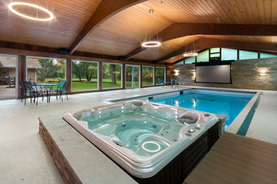Inspiration for a small 1950s indoor concrete and rectangular hot tub remodel in Milwaukee