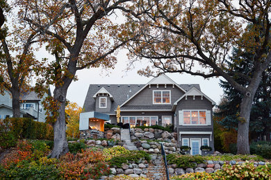 Example of a classic gray exterior home design in Minneapolis
