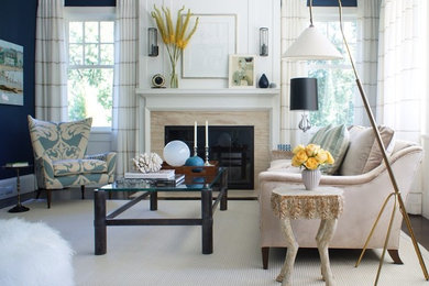 Example of a large trendy formal carpeted living room design in New York with blue walls, a standard fireplace, a stone fireplace and no tv