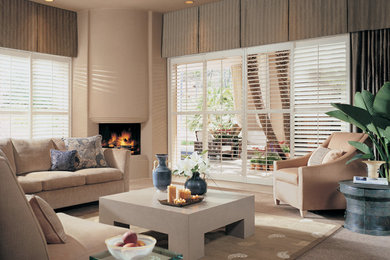 Inspiration for a mid-sized contemporary formal and enclosed carpeted and beige floor living room remodel in Phoenix with beige walls, a corner fireplace, a plaster fireplace and no tv