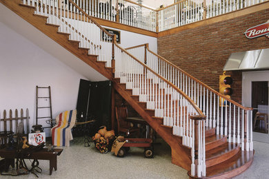 Inspiration for a large timeless wooden curved wood railing staircase remodel in Chicago with wooden risers