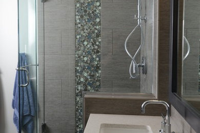 Inspiration for a mid-sized contemporary master gray tile and subway tile ceramic tile corner shower remodel in Boise with an undermount sink, recessed-panel cabinets, dark wood cabinets, quartz countertops and white walls