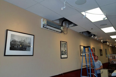 Certified Heating and Cooling installing Mitsubishi Mini Split at Pizza D-lux