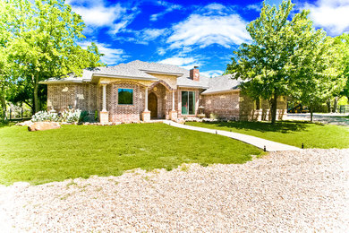 Inspiration for a large timeless exterior home remodel in Dallas