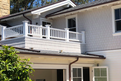Beach style white two-story house exterior photo in Santa Barbara
