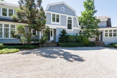 Large traditional gray two-story wood exterior home idea in Boston with a gambrel roof