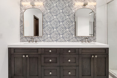 Inspiration for a large coastal master multicolored tile and ceramic tile porcelain tile, white floor and double-sink bathroom remodel in Seattle with shaker cabinets, gray cabinets, a two-piece toilet, white walls, an undermount sink, quartz countertops, a hinged shower door, white countertops, a niche and a built-in vanity
