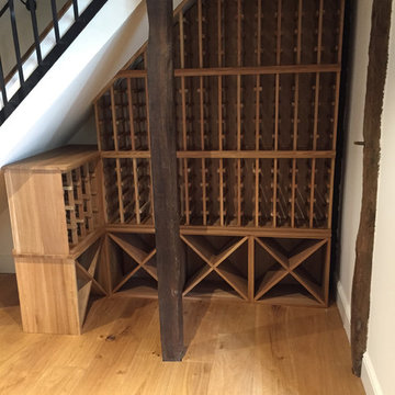 Under stairs wine racking in a private Hertfordshire home, racks & cubes in oak