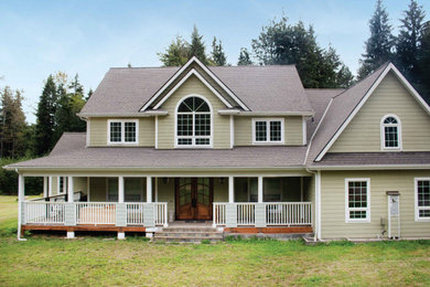 Exterior home idea in Seattle with a shingle roof and a brown roof