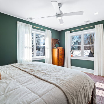 Light-Filled Green Primary Bedroom in Lakewood