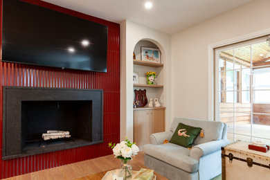 Inspiration for a large eclectic open concept light wood floor living room remodel in Chicago with white walls, a standard fireplace, a stone fireplace and a wall-mounted tv