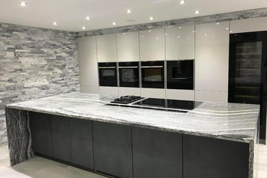 Contemporary Kitchen with dramatic feature walls of Sparkle Ice Grey Split Face