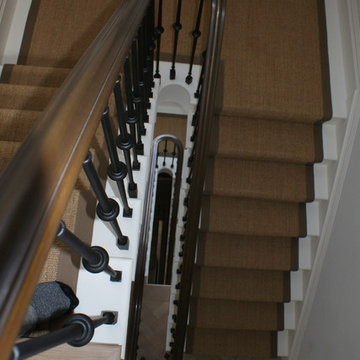 Fluted spindles with a bronze handrail.