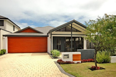 Inspiration for a contemporary one-storey beige exterior in Perth.