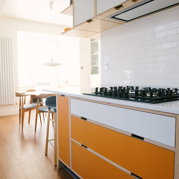 The Hennessy- Jones’s: Orange & White Laminated Plywood Kitchen