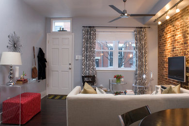 Example of a small minimalist open concept dark wood floor family room design in Philadelphia with multicolored walls, no fireplace and a wall-mounted tv