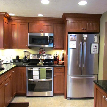 Transitional Peru Kitchen Remodel with Uba Tuba countertop.