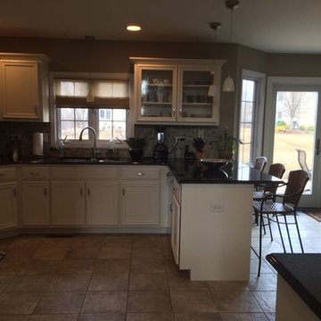 This is oak cabinets after we refinish dover white color