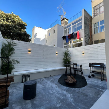 Private Terrace with White Timber Cladding and City Context