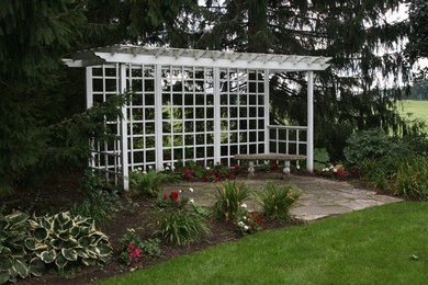 Photo of a traditional backyard formal garden in Other.