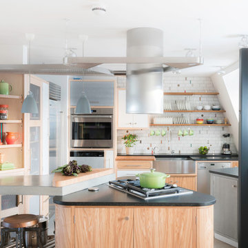 A light, contemporary loft kitchen with industrial finishes
