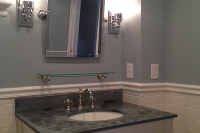 Inspiration for a 3/4 bathroom in Other with shaker cabinets, white cabinets, a corner tub, a shower/bathtub combo, white tile, subway tile, blue walls, mosaic tile floors and an undermount sink.