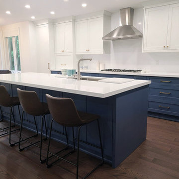 Two tone white and blue kitchen design.