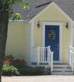 white house blue shutters wrap around porch