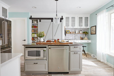 Inspiration for a large country ceramic tile kitchen remodel in Other with quartzite countertops, stainless steel appliances, an island, recessed-panel cabinets, gray cabinets and gray countertops