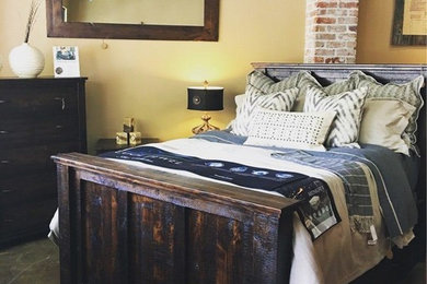 Inspiration for a large rustic master bedroom remodel in Seattle with beige walls