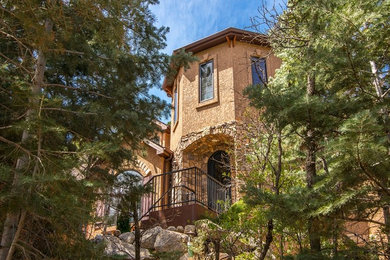 Example of a tuscan exterior home design in Denver