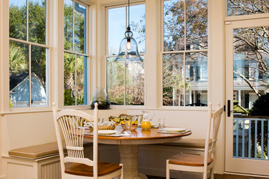 Design ideas for a traditional sunroom in Charleston with terra-cotta floors.