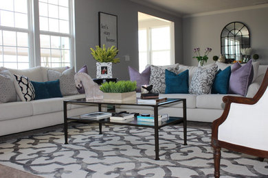 Inspiration for a mid-sized transitional open concept living room remodel in Indianapolis with gray walls and no fireplace