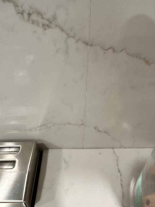 Quartz Backsplash Seams too much adhesive