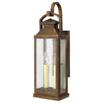 Hinkley - Hinkley 1184SN Medium Wall Mount Lantern, Dark Brass - Revere is a traditional coach lantern in solid brass with clear seedy glass panels. The glass faux candle sleeves and classic candelabra lamping complete the authentic appearance.