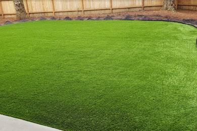 Design ideas for a modern full sun backyard landscaping in Portland.