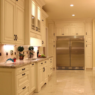 Luxurious Kitchen w/Antique White Cabinetry & Built-In Refrigerator