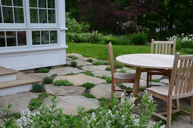 Small transitional backyard stone patio photo in Boston with no cover
