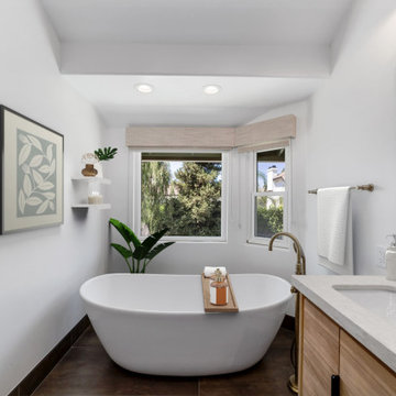 Santa Ana bathroom remodel with freestanding tub under bright window.