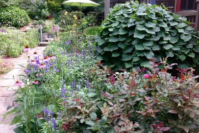 Inspiration for a mid-sized farmhouse full sun backyard concrete paver garden path in New York for summer.