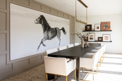 Example of a transitional gray floor and wall paneling dining room design in Denver with white walls