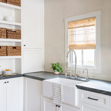 Transitional White Kitchen with Soapstone Counters and Heath Tile Backsplash