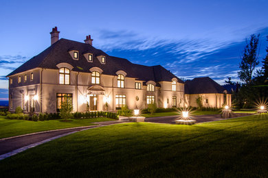 Huge transitional beige three-story house exterior idea in Bridgeport with a hip roof and a shingle roof